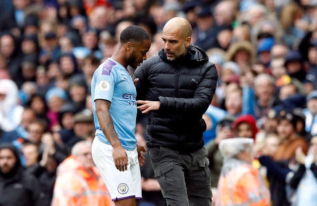 Manchester City manager Pep Guardiola and Raheem Sterling