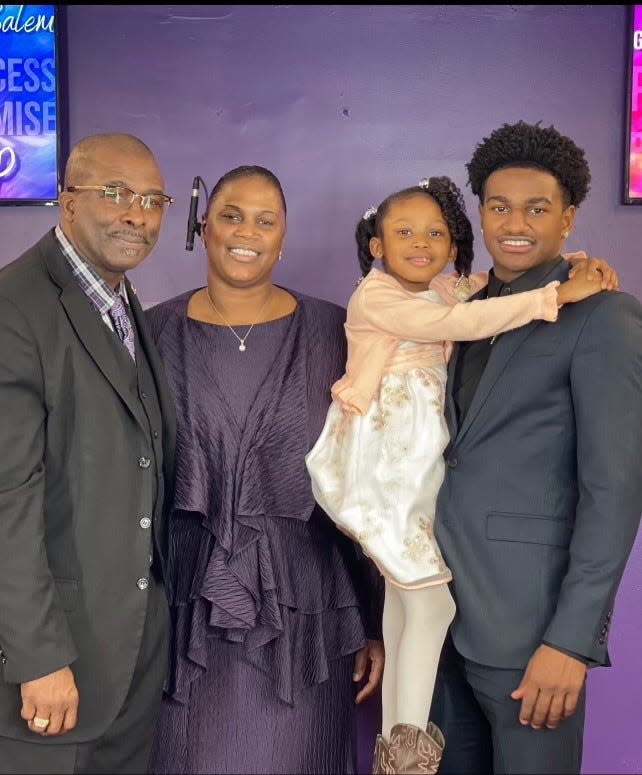 Oklahoma State basketball player John-Michael Wright (right) is pictured with his stepfather, Eddie Hightower (left), who passed away last year, mother April Hightower and sister Ebony Hightower. Wright will play his final college basketball game with the Cowboys this week at the Big 12 Tournament in Kansas City, Mo.