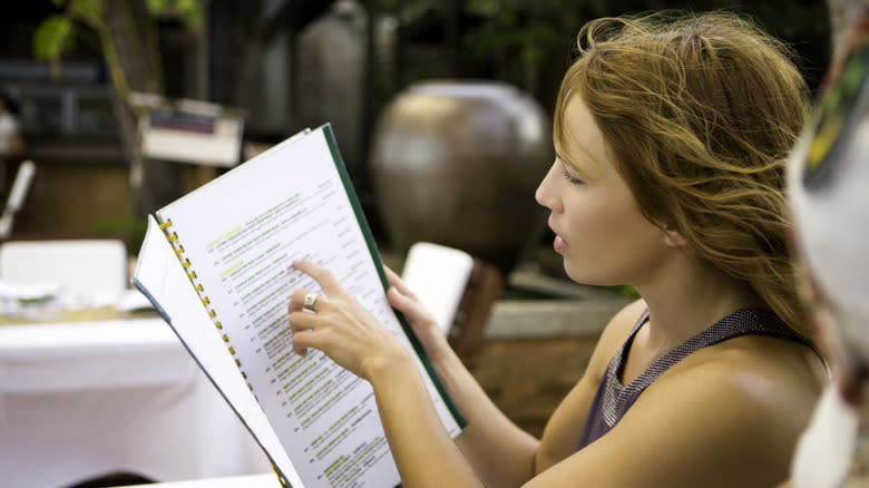 woman reading menu