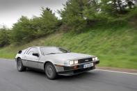 <p>While it looked like a supercar with its gull-wing doors, its build quality, alongside slothful performance, quickly put it under the tyres of the American and Italian cars it was trying to compete with. Its 2.8-litre V6 produced just 130bhp and gearbox choices were either a five-speed manual or sluggish three-speed automatic. </p><p>Forgetting its woes, we think the DMC-12's design cues, such as its brushed stainless steel body panels, quad headlights, slated rear boot lid and tyres that were almost too big for the bodywork, isolate it from anything ever produced by any other manufacturer. This, combined with a supple Lotus-tuned chassis, means that it sits comfortably in the cool category.</p>