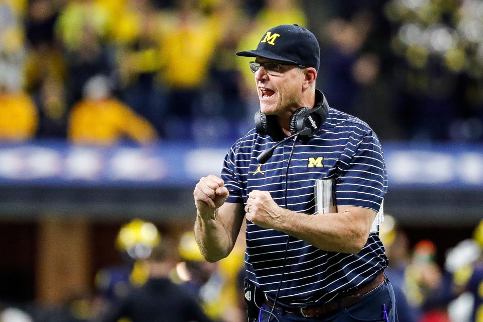 Michigan head coach Jim Harbaugh celebrates scoring a two point conversion against Purdue during the second half of the Big Ten Championship game against Purdue at Lucas Oil Stadium in Indianapolis, Ind., on Saturday, Dec. 3, 2022.