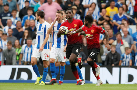 Soccer Football - Premier League - Brighton & Hove Albion v Manchester United - The American Express Community Stadium, Brighton, Britain - August 19, 2018 Manchester United's Paul Pogba celebrates scoring their second goal with Fred REUTERS/David Klein