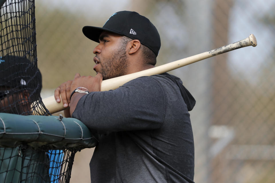 Miami Marlins' Jesus Aguilar takes batting practice during spring training baseball practice Sunday, Feb. 16, 2020, in Jupiter, Fla. (AP Photo/Jeff Roberson)