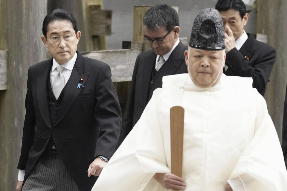 FILE - Japan's Prime Minister Fumio Kishida, left, visits Ise Jingu shrine in Ise, central Japan on Jan. 4, 2023. Japan and the United States will hold security talks between their foreign and defense ministers in Washington the day before Japanese Prime Minister Kishida lands in the U.S. capital next week wrapping up his tour of Group of Seven nations as Tokyo expands its military and deepen alliance with America amid China's growing influence.(Kyodo News via AP, File)