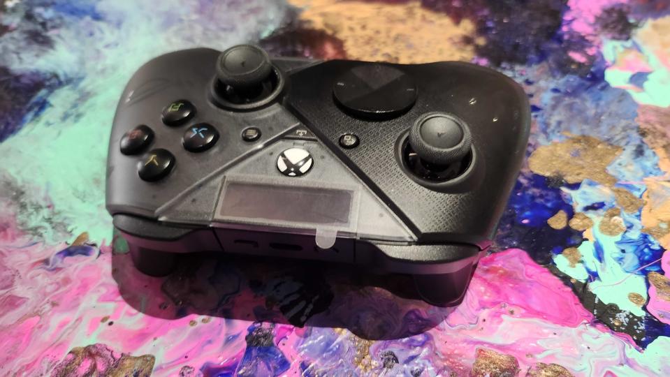 Asus ROG Raikiri controller on a colourful background