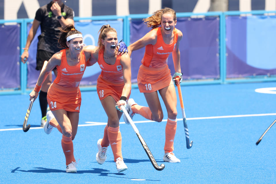 TOKYO, JAPAN - AUGUST 04: Eva Roma Maria de Goede, Pien Sanders and Felice Albers of Team Netherlands celebrate the fifth goal scored during the Women's Semifinal match between Netherlands and Great Britain on day twelve of the Tokyo 2020 Olympic Games at Oi Hockey Stadium on August 04, 2021 in Tokyo, Japan. (Photo by Alexander Hassenstein/Getty Images)