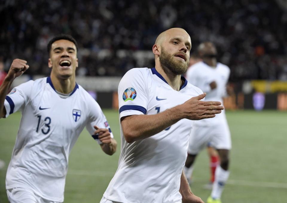 Teemu Pukki of Finland, right, celebrates his goal during the Euro 2020 Group J qualifying soccer match between Finland and Liechtenstein in Helsinki, Finland, on Friday, Nov. 15, 2019. (Martti Kainuleinen/Lehtikuva via AP)