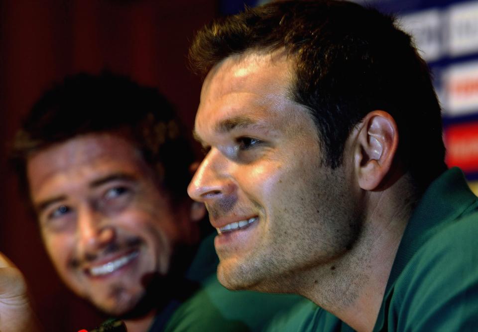 Mark Viduka and Harry Kewell laugh during a media conference.