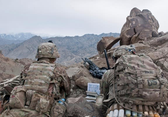 U.S. Army officers scan a distant ridgeline during a patrol in Paktya province in Afghanistan on Feb. 13, 2013.