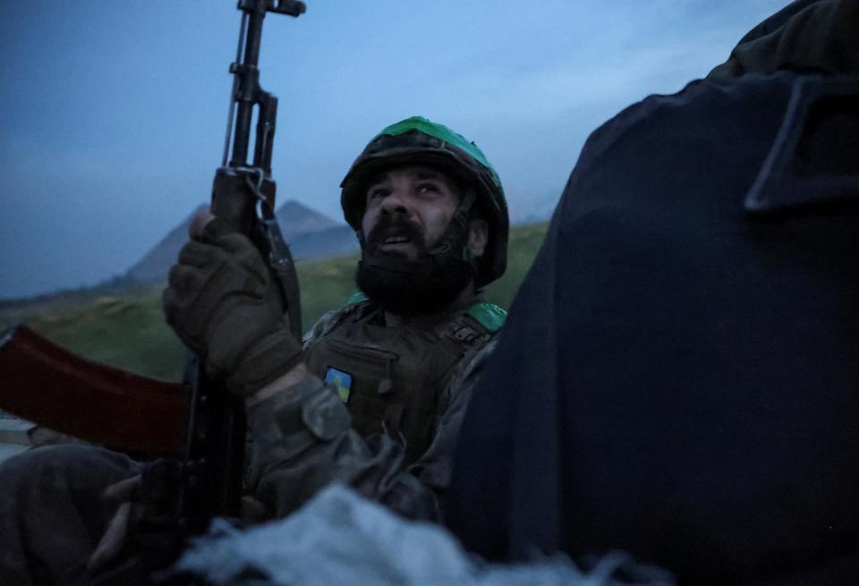 PHOTO: A Ukrainian serviceman of the 25th Separate Airborne Brigade of the Armed Forces of Ukraine monitors a sky as he rides in a car near a front line, amid Russia's attack on Ukraine, near Pokrovsk, Donetsk region, Ukraine August 31, 2024. (Serhii Nuzhnenko/Reuters)