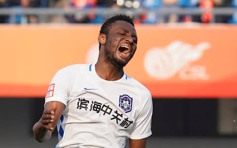 John Obi Mikel #10 of Tianjin Teda in action during 2018 China Super League match between Beijing Renhe and Tianjin Teda  - Credit: XIN LI/Getty Images