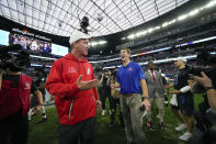 AFC coach Peyton Manning, left, jokes with NFC coach Eli Manning after the flag football event at the NFL Pro Bowl, Sunday, Feb. 5, 2023, in Las Vegas. (AP Photo/John Locher)