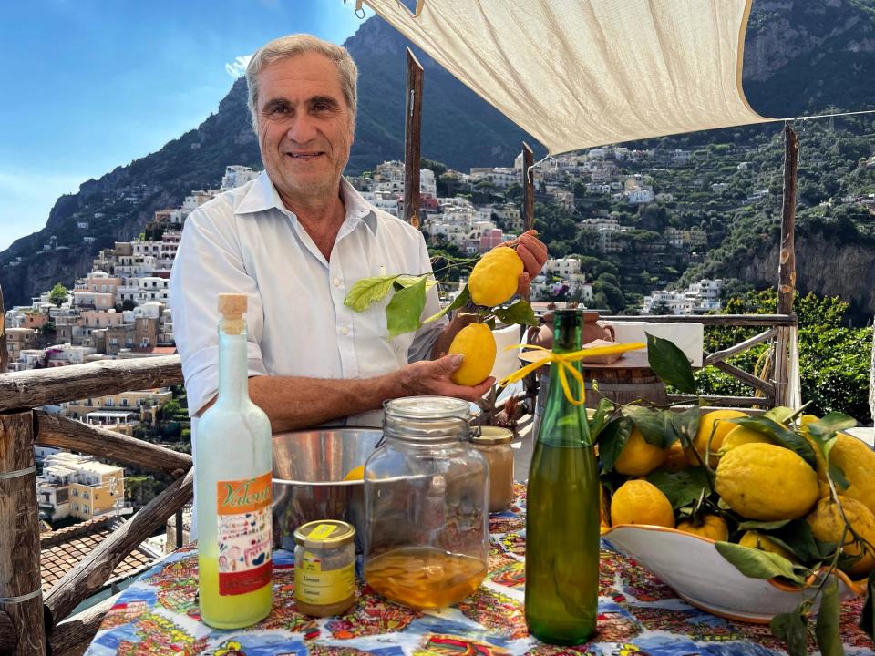 Valentino Esposito provides hands-on instruction for limoncello and marmalade against a backdrop of Positano