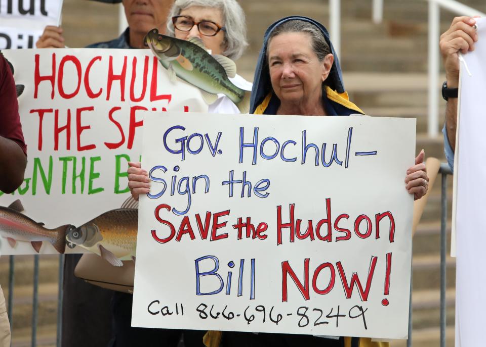 Advocate Judy Allen of Putnam Valley holds a sign during a rally urging Gov. Kathy Hochul to sign a bill that would make it illegal for Holtec International to discharge radioactive waste in the Hudson River August 15, 2023 at Westchester County Center in White Plains.