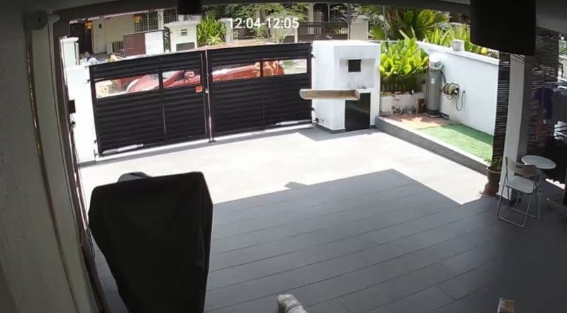 A video recording shows a delivery person from Shopee tossing three items into a customer’s car porch. — Picture via SoyaCincau