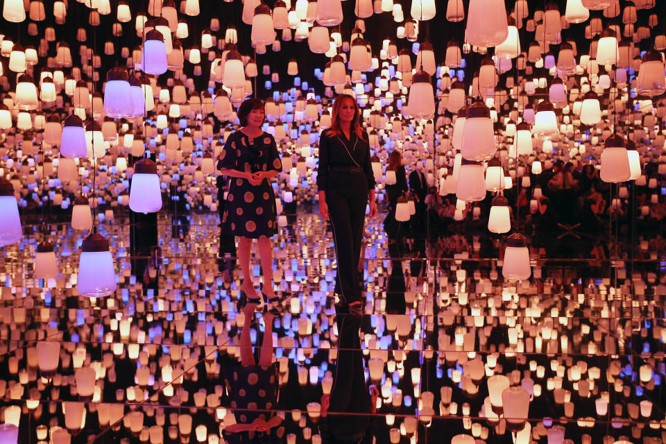 U.S. first lady Melania Trump, right, and Japanese Prime Minister Shinzo Abe's wife Akie Abe visit a digital art museum Sunday, May 26, 2019, in Tokyo. (AP Photo/Koji Sasahara)