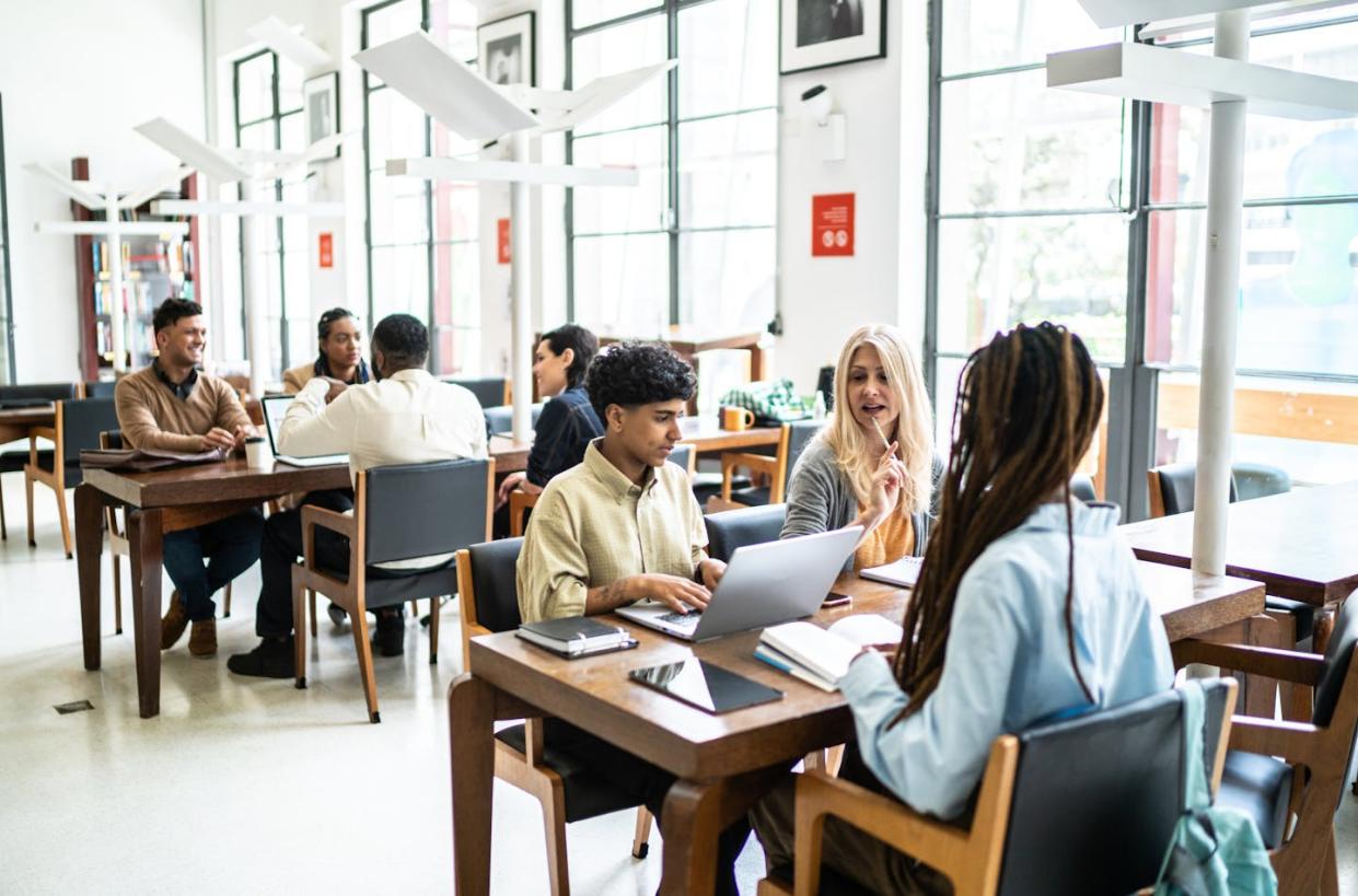 Community colleges struggled with enrollment drops during the pandemic. <a href="https://www.gettyimages.com/detail/photo/people-studying-in-a-library-royalty-free-image/1448106657?phrase=community+college&adppopup=true" rel="nofollow noopener" target="_blank" data-ylk="slk:FG Trade via Getty Images;elm:context_link;itc:0;sec:content-canvas" class="link ">FG Trade via Getty Images</a>