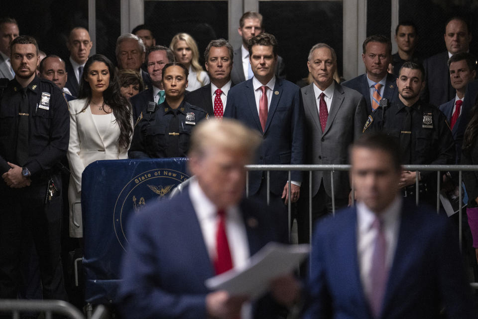 House Republicans, from left., Anna Paulina Luna, R-Fla., Michael Waltz, R-Fla., Andy Ogles, R-Tenn., Matt Gaetz, R-Fla., and Andy Biggs, R-Ariz., looks on as former President Donald Trump talks with the media at Manhattan criminal court in New York, on Thursday, May 16, 2024. (Jeenah Moon/Pool Photo via AP)