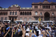 Argentina's newly sworn-in President Javier Milei addresses to supporters from the balcony of the government house in Buenos Aires, Argentina, Sunday, Dec. 10, 2023. (AP Photo/Matilde Campodonico)