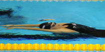 US swimmer Natalie Coughlin competes in the final of the women's 4x100-metre medley relay swimming event in the FINA World Championships at the indoor stadium of the Oriental Sports Center in Shanghai on July 30, 2011. The United States won gold. AFP PHOTO / MARK RALSTON (Photo credit should read MARK RALSTON/AFP/Getty Images)