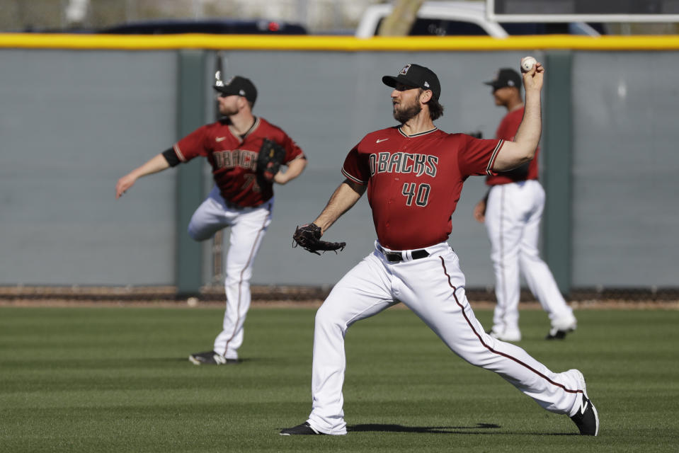 Arizona Diamondbacks' Madison Bumgarner throws during spring training baseball practice, Sunday, Feb. 16, 2020, in Scottsdale, Ariz. (AP Photo/Darron Cummings)