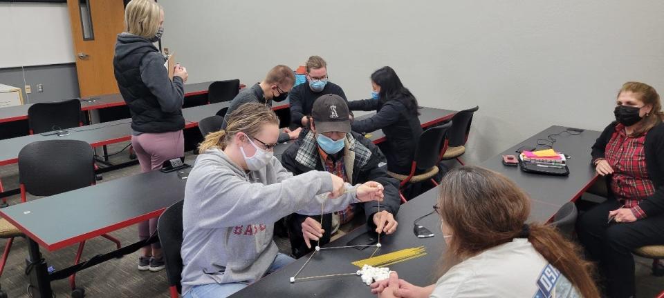 A Valley Packaging Industry instructor, clients and  University of Wisconsin-Oshkosh students participating  in a team building activity during the VPI Thrive Career Academy Program, a 12 weeks long camp held at UWO Fox Cities Campus in Fall 2021.