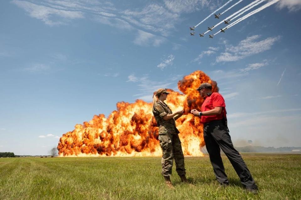 Madison Marsh sets off the wall of fire during an airshow