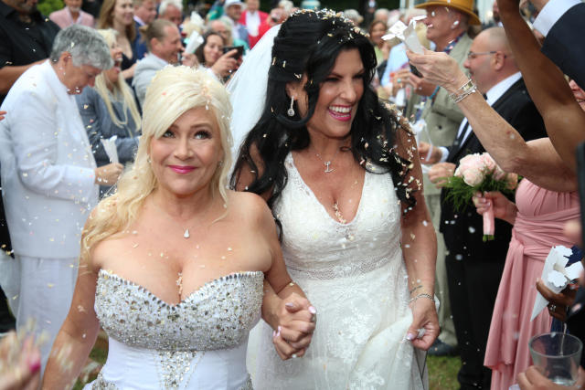 Samantha Fox and her bride Linda Birgitte Olsen both wore traditional white wedding gowns to tie the knot. (Fox Media via Getty Images)