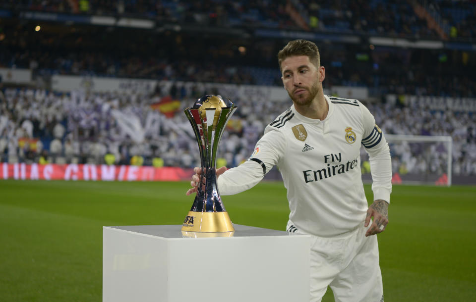 Sergio Ramos picks up the FIFA Club World Cup won by Real Madrid to present his fans at the Santiago Bernabeu Stadium on January 6, 2018 in Madrid, Spain. (Photo by Patricio Realpe/ChakanaNews/NurPhoto via Getty Images)