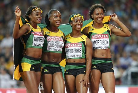 Elaine Thompson, Veronica Campbell-Brown, Shelly-Ann Fraser Pryce and Natasha Morrison of Jamaica react after winning women's 4x100m relay during the 15th IAAF World Championships at the National Stadium in Beijing, China August 29, 2015. REUTERS/Lucy Nicholson