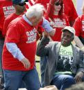 UAW president Dennis Williams, left, is congratulated on his comments by actor Danny Glover at a pro-union rally near Nissan Motor Co.'s Canton, Miss., plant, Saturday, March 4, 2017. Participants marched to the plant to deliver a letter to the company demanding the right to vote on union representation to address better wages, safe working conditions and job security. (AP Photo/Rogelio V. Solis)