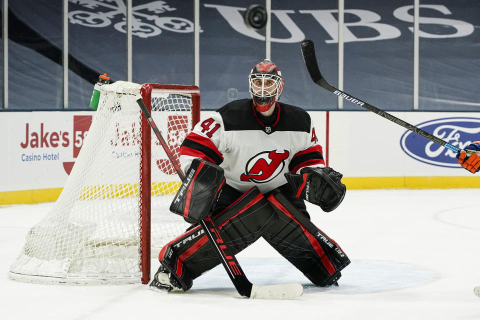 New Jersey Devils goaltender Scott Wedgewood defends the goal during the second period of the team's NHL hockey game against the New York Islanders on Thursday, Jan. 21, 2021, in Uniondale, N.Y. (AP Photo/Frank Franklin II)