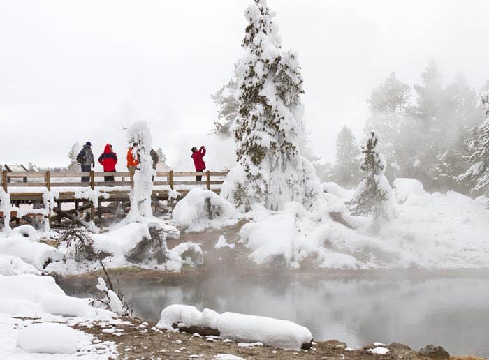 Yellowstone visitors at Leather Pool in winter.