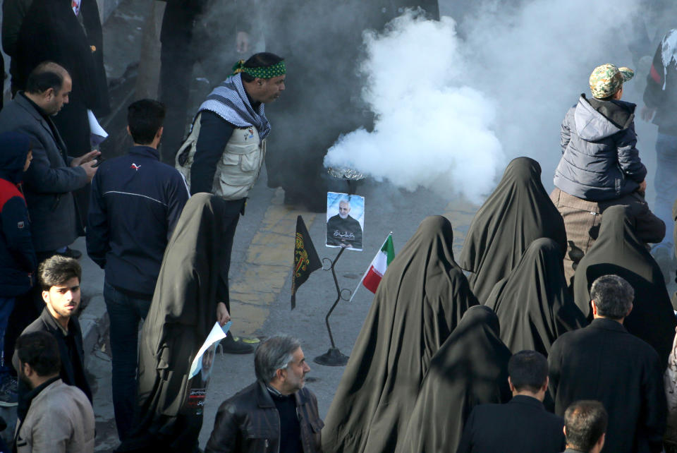 An Iranian mourner burns incense during the final stage of funeral processions for slain top general Qasem Soleimani, in his hometown Kerman on January 7, 2020. - Soleimani was killed outside Baghdad airport on January 3 in a drone strike ordered by US President Donald Trump, ratcheting up tensions with arch-enemy Iran which has vowed "severe revenge". The assassination of the 62-year-old heightened international concern about a new war in the volatile, oil-rich Middle East and rattled financial markets. (Photo by ATTA KENARE / AFP) (Photo by ATTA KENARE/AFP via Getty Images)