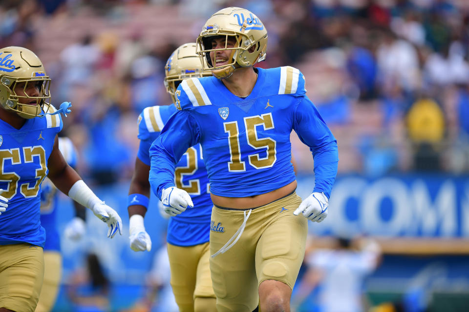 Sep 16, 2023; Pasadena, California, USA; UCLA Bruins defensive lineman Laiatu Latu (15) celebrates after intercepting a pass against the North Carolina Central Eagles during the first half at Rose Bowl. Mandatory Credit: Gary A. Vasquez-USA TODAY Sports