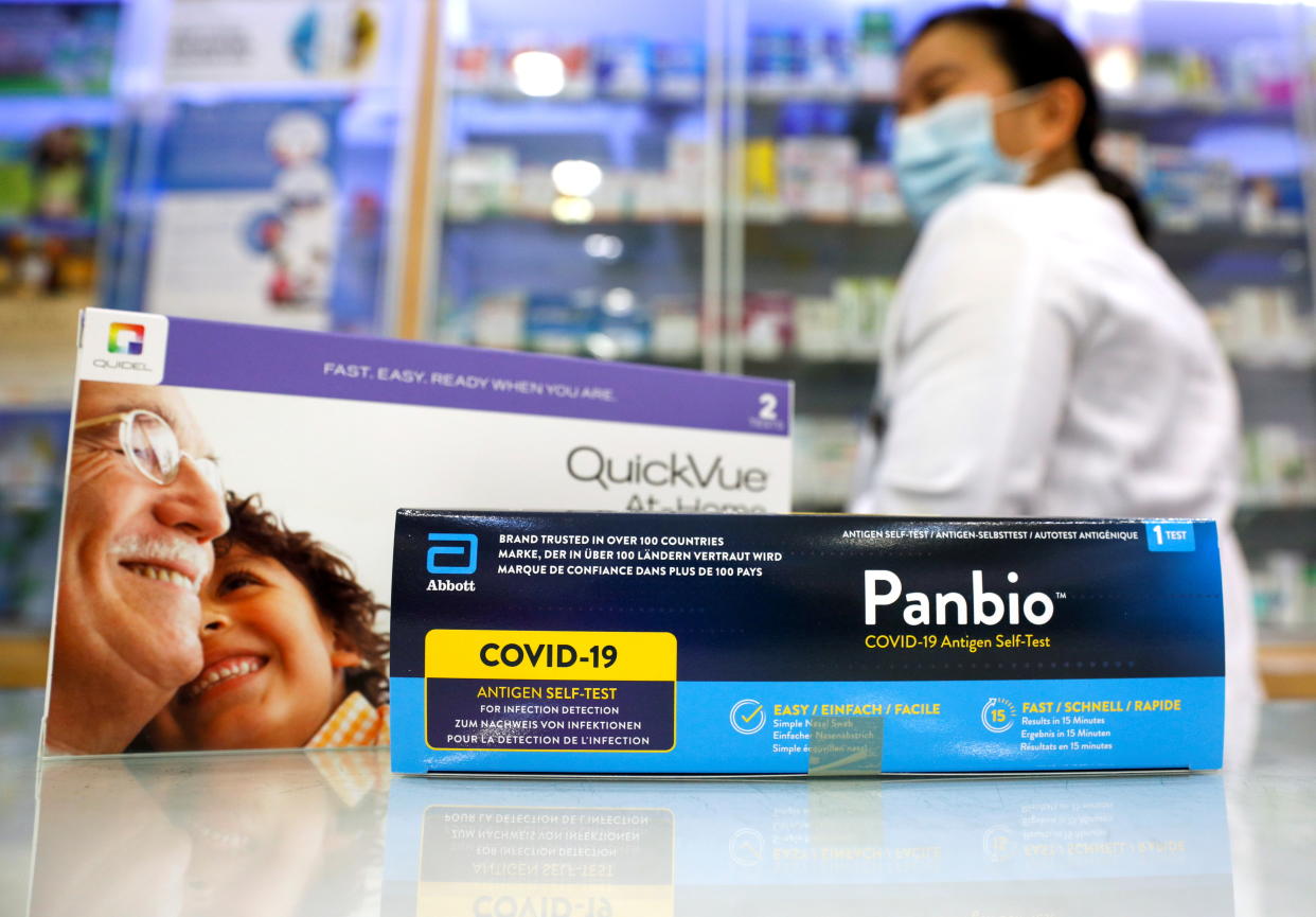 A pharmacist displays the coronavirus disease (COVID-19) antigen rapid test (ART) kits for self-testing to the media at a Watsons pharmacy in Singapore June 16, 2021.   REUTERS/Edgar Su