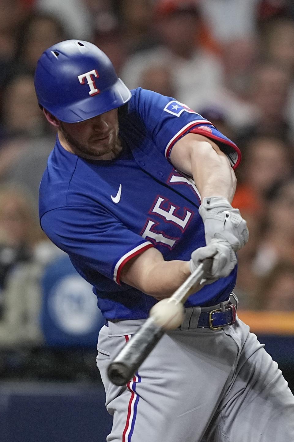 Texas Rangers' Mitch Garver hits a home run during the second inning of Game 6 of the baseball AL Championship Series Sunday, Oct. 22, 2023, in Houston. (AP Photo/David J. Phillip)