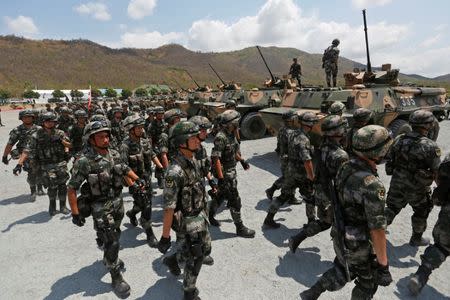 China's army soldiers attend the opening of the "Dragon Gold 2018" military exercise in Kampong Speu province, Cambodia, March 17, 2018. REUTERS/Stringer