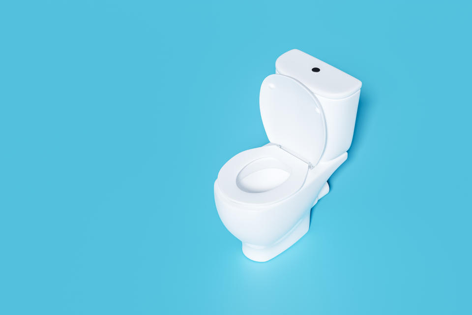 Toilet with a smartphone in place of the tank, concept for modern bathroom gadgets