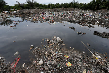 A view of plastic waste dumping site at palm oil plantation in Telok Panglima Garang, Malaysia October 14, 2018. Picture taken October 14, 2018. REUTERS/Lai Seng Sin