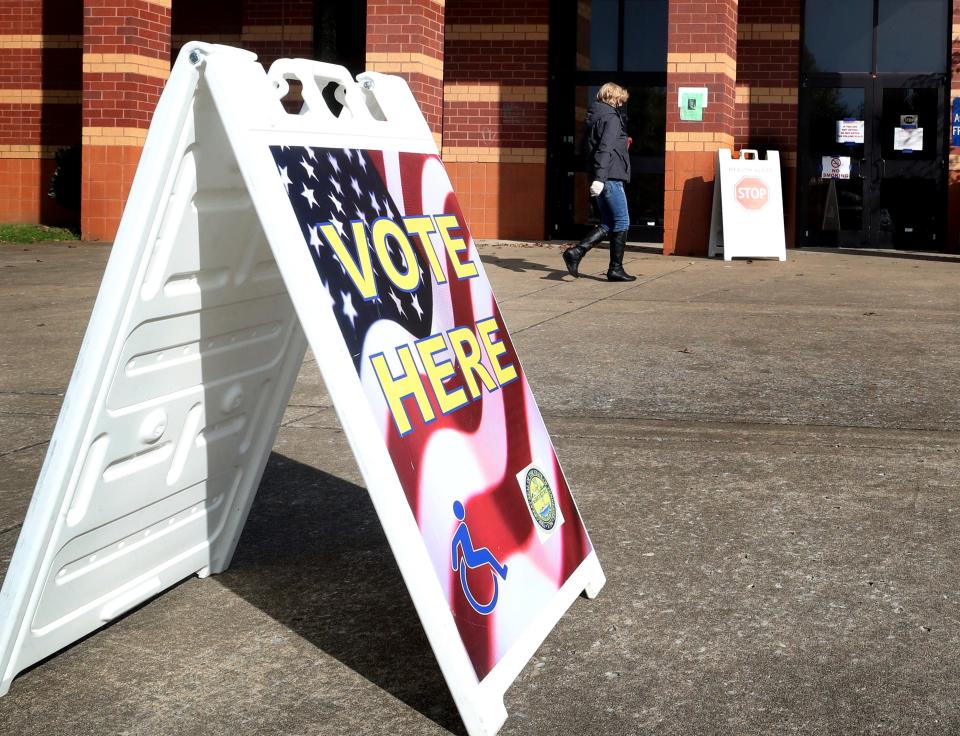Voters in this file photo from Nov. 3, 2020, walk into Barfield Elementary to vote on Election Day.