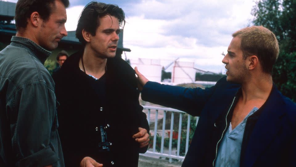 (Center from left) Tom Tykwer, director, and actor Moritz Bleibtreu on the set of "Run Lola Run" in 1998. - Sony Pictures/Courtesy Everett Collection