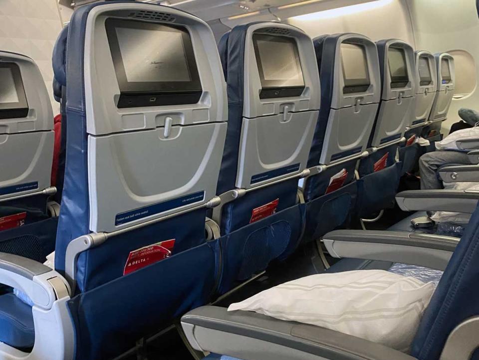 A row of empty seats on a Delta airplane during COVID.