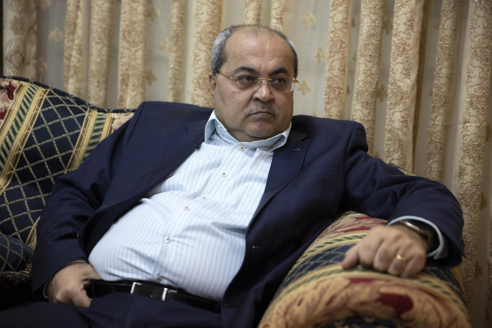 In this Wednesday, March 6, 2019 photo, Arab lawmaker Ahmad Tibi speaks during an interview with the Associated Press at his home in Jerusalem. When Prime Minister Benjamin Netanyahu runs into trouble, he has a long history of lashing out at the media, the political opposition and Israel's Arab minority with incendiary and divisive language. (AP Photo/Sebastian Scheiner)
