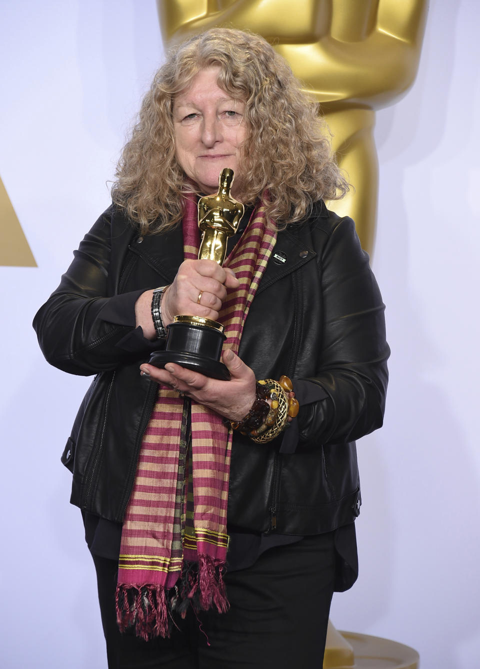 FILE - Jenny Beavan poses with the award for best costume design for "Mad Max: Fury Road" at the Oscars in Los Angeles on Feb. 28, 2016. Beavan designed the costumes for the film "Cruella." (Photo by Jordan Strauss/Invision/AP, File)