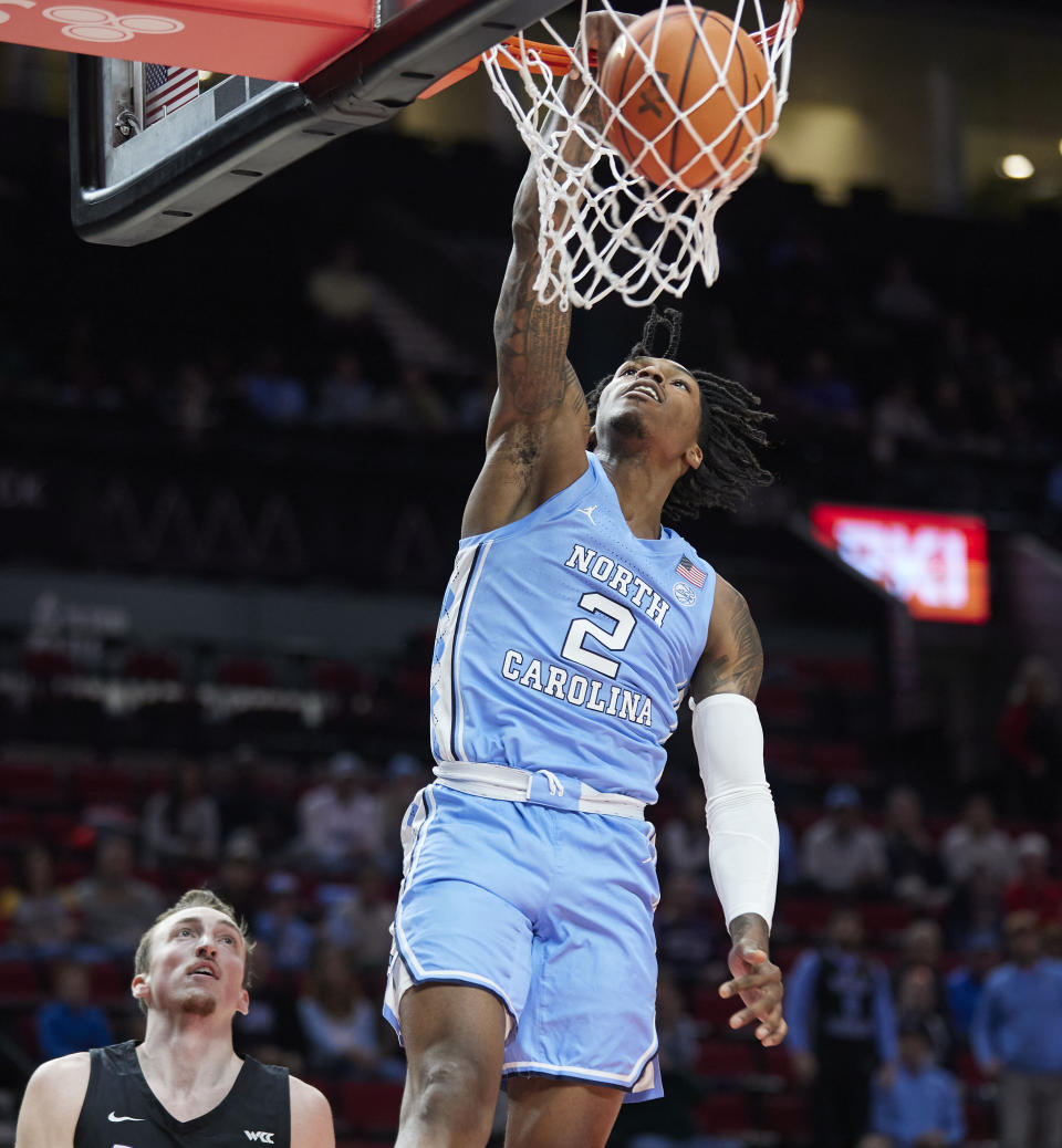 North Carolina guard Caleb Love dunks the ball against Portland during the first half of an NCAA college basketball game in the Phil Knight Invitational tournament in Portland, Ore., Thursday, Nov. 24, 2022. (AP Photo/Craig Mitchelldyer)