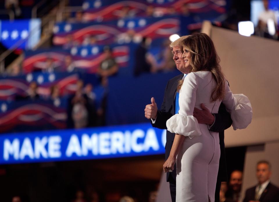 Donald Trump and his wife, Melania, enjoy the applause after her speech at the Republican National Convention on Monday, July 18, 2016, in Cleveland. (Photo: Khue Bui/Yahoo News)