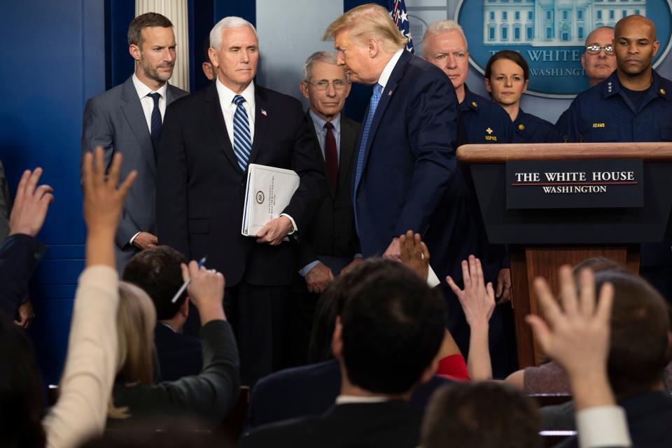 Reporters ask questions as US President Donald Trump departs after speaking during a press briefing about the Coronavirus (COVID-19) alongside US Vice President Mike Pence and members of the Coronavirus Task Force in the Brady Press Briefing Room at the White House in Washington, DC, March 15, 2020. (Jim Watson/AFP via Getty Images)