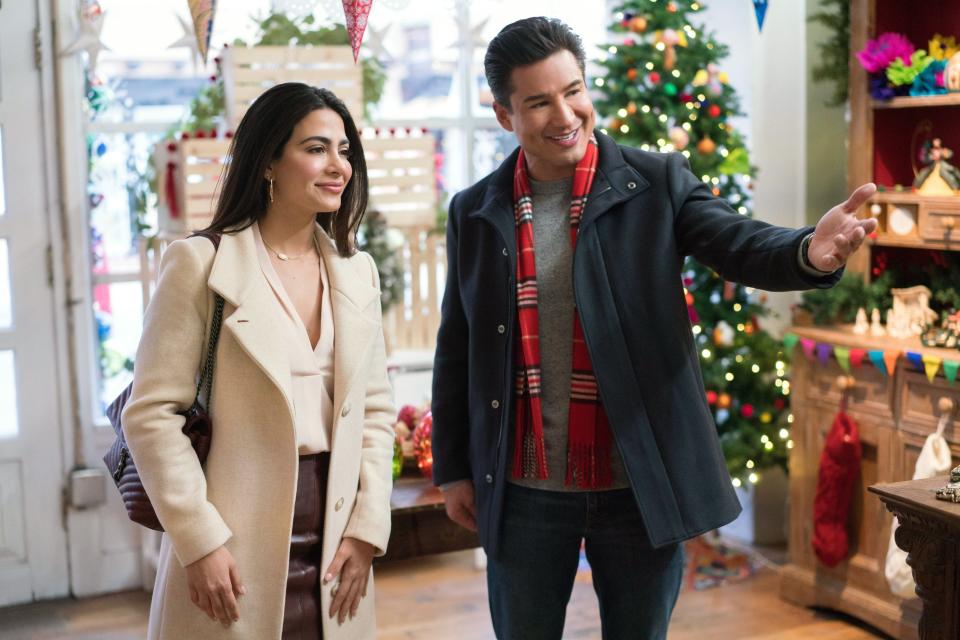 Mario Lopez in a scene with his "Holiday in Santa Fe" co-star, Emeraude Toubia.