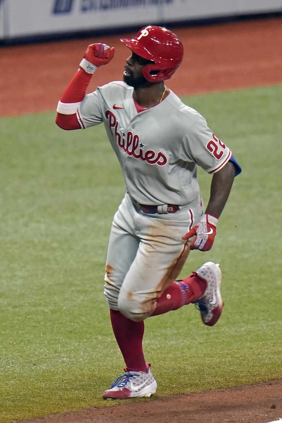 Philadelphia Phillies' Andrew McCutchen (22) celebrates his solo home run off Tampa Bay Rays relief pitcher Peter Fairbanks during the fifth inning of a baseball game Saturday, Sept. 26, 2020, in St. Petersburg, Fla. (AP Photo/Chris O'Meara)